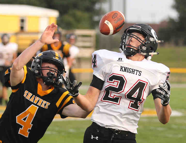 Shawnee's Luke Myers breaks up a pass meant for Greenon's Luke Downing during their season opener at Shawnee.  (Bill Lackey / Springfield News-Sun)